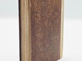 an old book that is sitting on a table
