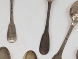 a lot of spoons and spoon spoons on the table