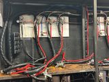 many wires on the shelves in the room
