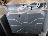an image of a washing machine in a room