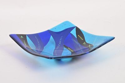 a glass bowl with a blue and black design on it
