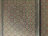 two antique rugs, one with a floral design and the other with a floral design