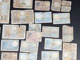 some old paper money sitting on top of a table next to each other