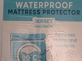 a box of waterproof mattress protectors on a table