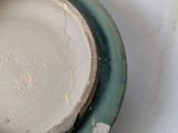 a plate with a small bowl on it on a table