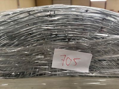 a pile of wire wrapped in plastic with a price tag on it