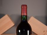 a bottle of wine that is sitting on a table