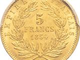 a close up of a gold coin on a white background
