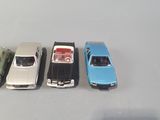 several toy cars are lined up in a row on a table