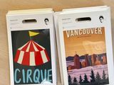two luggage tags on a table with a picture of a circus tent