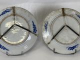 two plates with blue and white designs on them