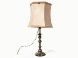 a lamp that is on a table with a white background