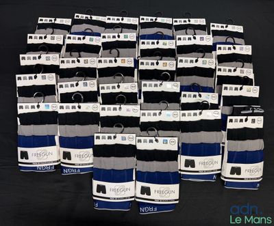 many pairs of men ' s socks with tags on them
