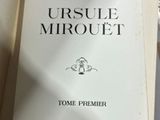 an open book with a picture of a man on it sitting on a table