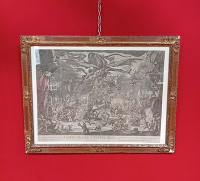 une vieille photo d'un tableau accroché à un mur rouge