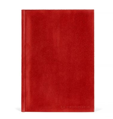 un cahier rouge avec une couverture rouge sur fond blanc