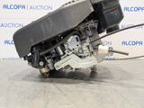 a close up of the engine of a car on a floor