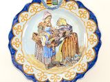 a plate with a picture of a man and a woman on it