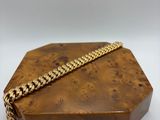 a small wooden box with a chain around it
