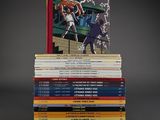 many books stacked on top of each other on a table
