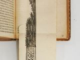 an open book with a drawing of a knife on it