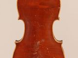 an old violin with a wooden back and a long neck