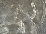 an image of a clear plastic object with a clock on it