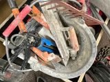 a pile of assorted items in a bin on the floor