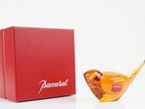 an image of a red box with a glass bird next to it