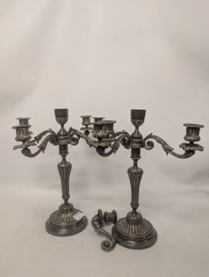 a pair of antique silver plated candelabs