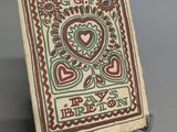 a small tile with a picture of a heart on it