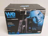 a black box with a remote control and a picture of a woman