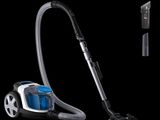 a vacuum that is sitting on a black surface