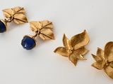 three pairs of gold and lapis earrings with blue stones