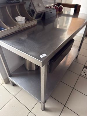 a stainless steel table in a commercial kitchen