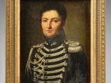 a painting of a man in a military uniform in a gold frame