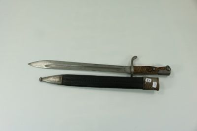 two knives that are laying on top of a table