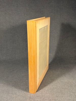 a wooden picture frame with a picture in it on a gray background