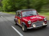 a small red car that is driving down the road