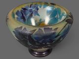 a blue and yellow bowl sitting on top of a table