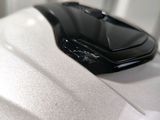 a close up of a cell phone on a white surface