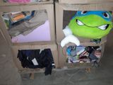 a cardboard box with a stuffed animal inside of it