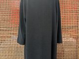 the back view of a black coat on a mannequin mannequin mannequin mannequin mannequin mannequin mannequin manne