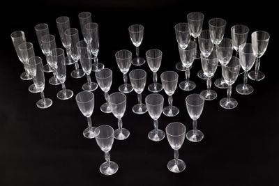 several empty wine glasses are arranged in a heart shape on a black background