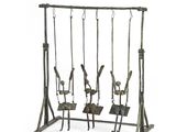 a metal swing set with four swings attached to it