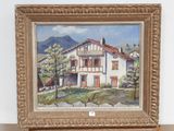 a picture of a painting of a house on a shelf