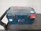 a blue tool box sitting on top of a black cart