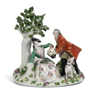 une image représentant une figurine d'un homme et d'une femme accompagnés d'un chien