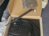 a box with a cable and a charger inside of it