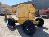 a yellow crane that is parked in a parking lot